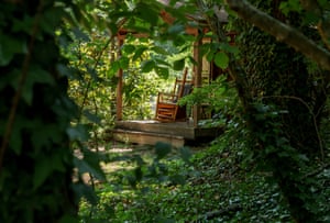 An empty rocking chair on a porch at the Pine Gables cabins at Lake Lure