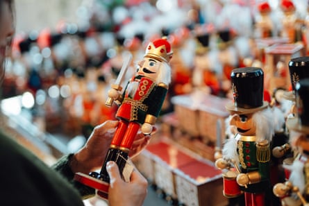 A woman shops for nutcracker decorations.