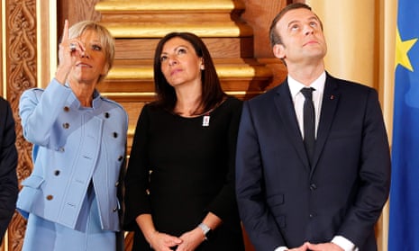 Paris mayor Anne Hidalgo flanked by France’s president, Emmanuel Macron, and his wife