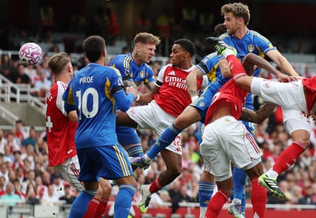 Arsenal’s Jurrien Timber (centre) heads home to open the scoring.