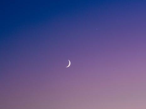 The moon over the road.