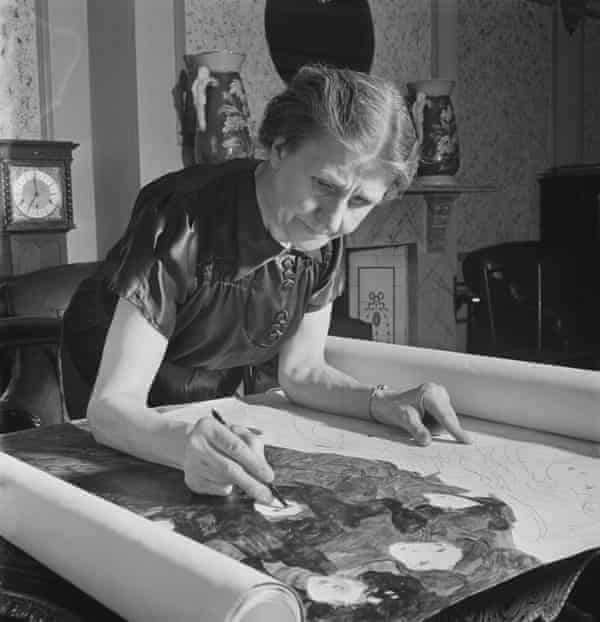 Madge Gill working on a section of a large pen and ink piece on fabric at her home in East Ham, London, on 19 August 1947.