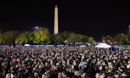 People attend a campaign rally for Kamala Harris on the Ellipse in Washington.
