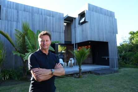 George Clarke in front of Pinwheel House on Great Barrier Island … George Clarke’s Homes in the Wild.