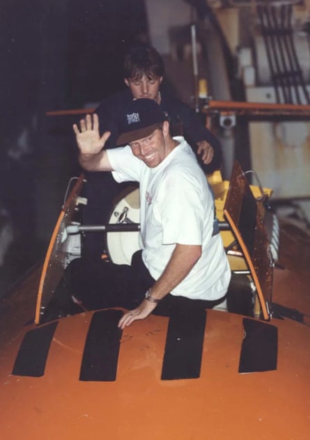 Rogers waves as he exits the sub