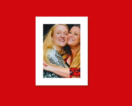 Catherine and Annabel embrace for a photograph against a dark background