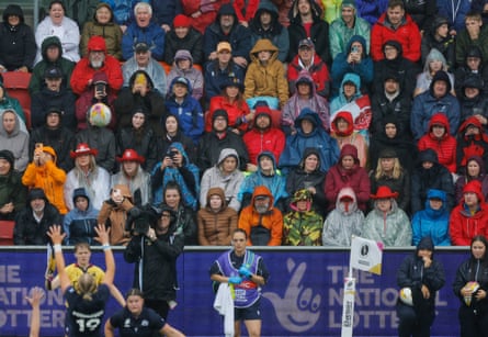Wet spectators watch a lineout in the rain during the Women’s Rugby World Cup 2025 quarter-final match between England and Scotland at Ashton Gate.