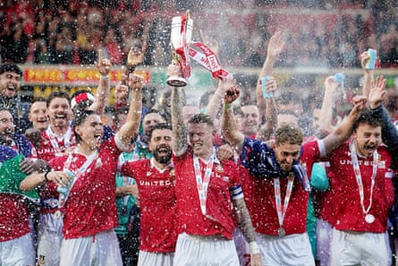 Wrexham celebrate their promotion to the Championship.