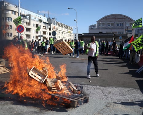 Striking workers burning pallets