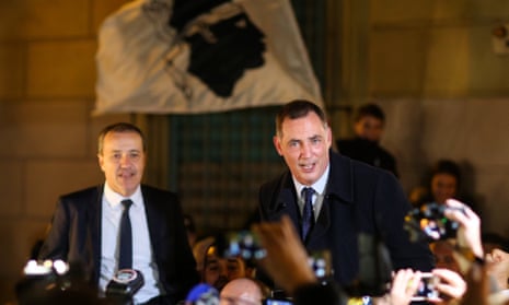 Gilles Simeoni (right) and Jean-Guy Talamoni celebrate their victory in the second round of regional elections.