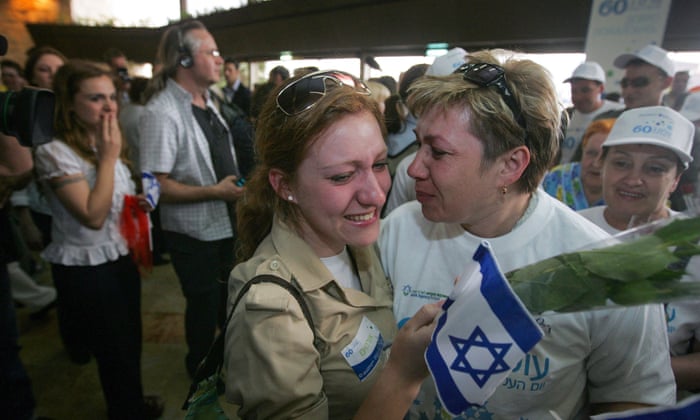 Russia-Ukraine war: Kyiv and Moscow sign deal to allow grain exports from blockaded Black Sea ports – live 2 In this file photo taken on 5 May, 2008, a Russian immigrant to Israel is embraced by well-wishers holding flowers and Israeli flags as she arrives at Israel’s Ben Gurion airport.