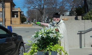 Coronavirus live news: record daily cases in South Africa as India extends lockdown 6 Timothy Pelc conducts the traditional Blessing of the Easter Baskets at St Ambrose Catholic church in April.