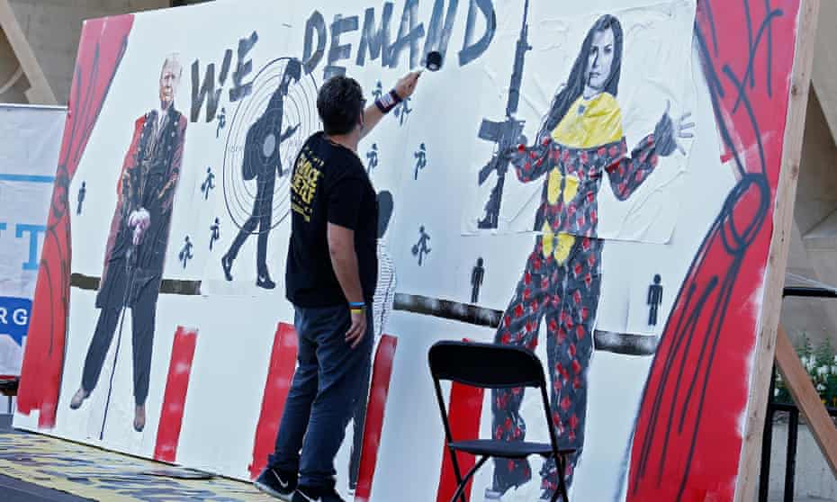 Oliver’s mural depictesa student wearing a backpack in the crosshairs of a gun, flanked by Trump and NRA spokeswoman Dana Loesch.