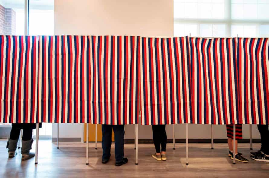 Voters fill in their ballots at polling booths in Concord, New Hampshire, on 3 November 2020.