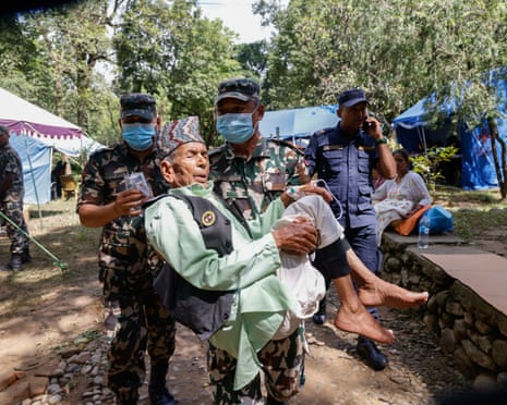 Flash flood survivors receive medical treatment at an army base in Nepal's Nuwakot district