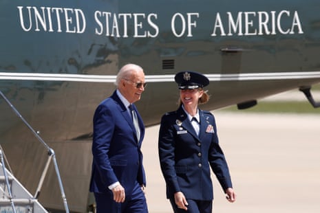 Joe Biden, escorted by Air Force Colonel Angela Ochoa, walks from Marine One to Air Force One at Andrews Air Force Base, Maryland, on Tuesday.