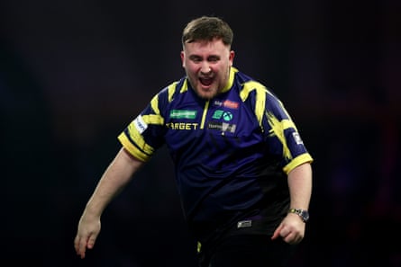 Luke Littler celebrates against Mensur Suljovic