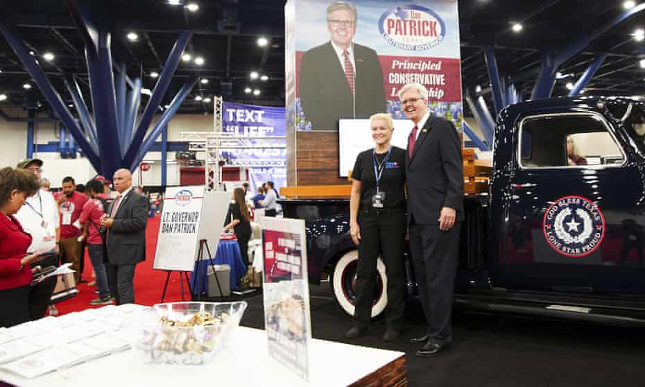 Texas lt governor Dan Patrick poses for photos with supporters during the first day of the Texas Republican party convention in Houston, on 15 June.