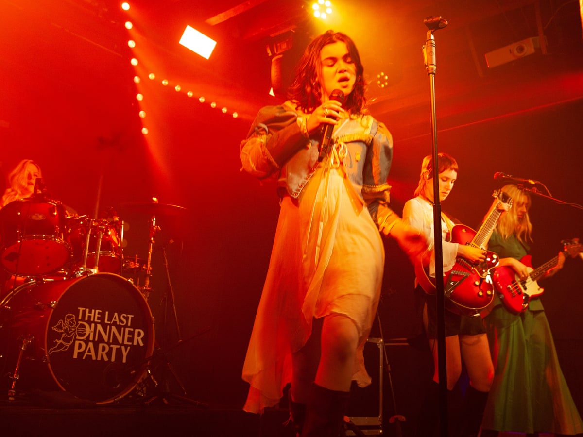 the last dinner party red dress Genuinely one of the best shows Ive ever been to, what an incredibly talented band. From The Last Dinner Party, heres part of Godzilla, featuring the customized cheesehead I gave the band earlier in