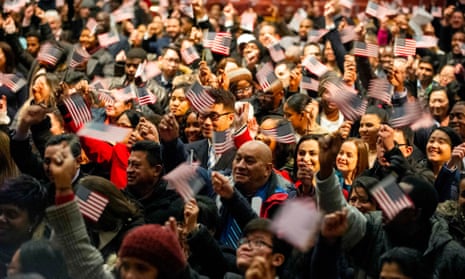 Newly sworn in US citizens celebrate during a naturalization ceremony where 633 immigrants became US citizens on January 22 in Lowell, Massachusetts. 