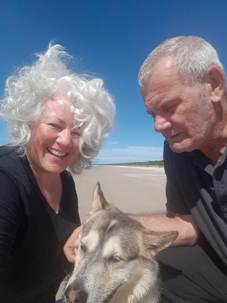 Annetta Mallon, her husband Pete and their dog, Cully on Seven Mile Beach in north-west Tasmania.