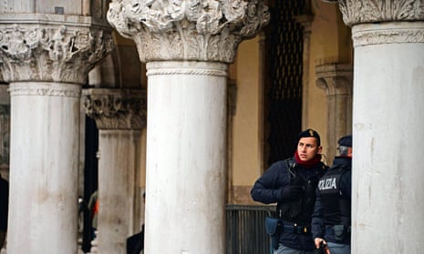 Policemen stand in front of the Venice’s Doge’s Palace in Venice in January.