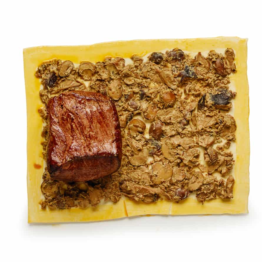 Put the seared beef at one end of the pastry, then roll, eggwash to seal, and roast for half an hour-plus.