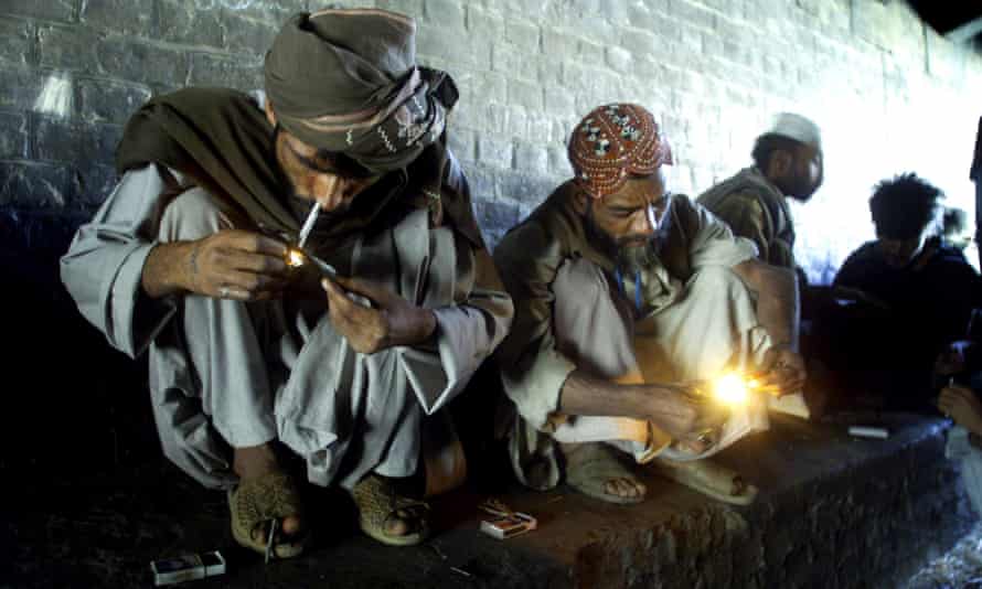 Men smoking heroin in Quetta, Pakistan, near the border with Afghanistan.