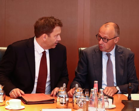 German chancellor Friedrich Merz and his coalition co-leader, SPD party leader and finance minister, Lars Klingbeil attend a cabinet meeting at the chancellery in Berlin, Germany.