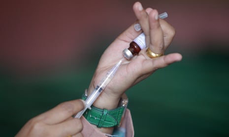 A nurse prepares a diphtheria vaccination