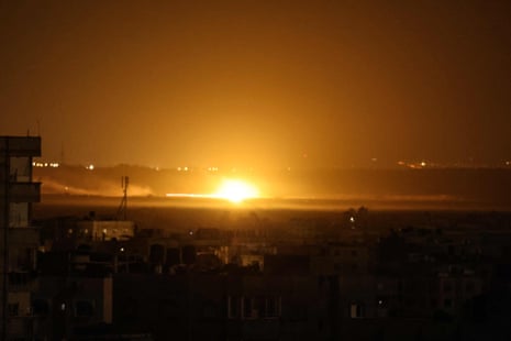 Picture taken from Rafah, showing a ball of fire lighting the sky during an Israeli strike on eastern Khan Younis in the southern Gaza Strip.