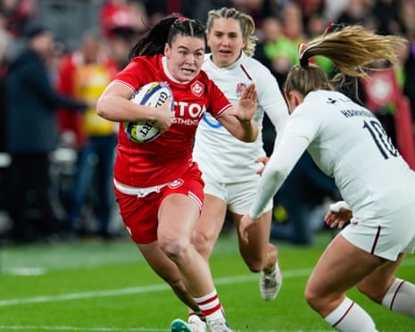 EnglandâÂÂs Zoe Harrison tackles CanadaâÂÂs Alysha Corrigan during the WXV series rugby match at BMO Field in Toronto