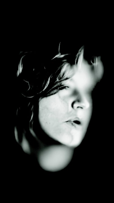 A person with their face pressed against glass