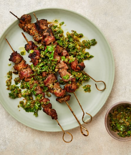 Yotam Ottolenghi’s spiced lamb skewers with caper and oregano salsa.