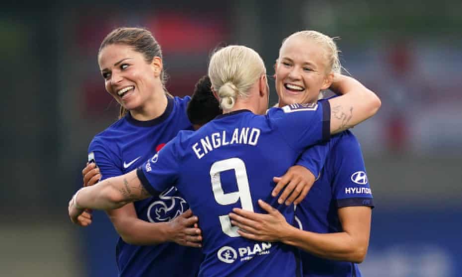 Cheslea’s Pernille Harder (right) celebrates scoring her side’s fourth goal against Everton.