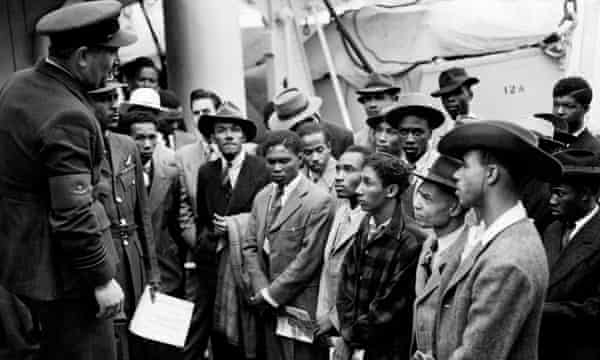 Jamaican immigrants are welcomed by RAF officials after the Empire Windrush landed at Tilbury in 1948.