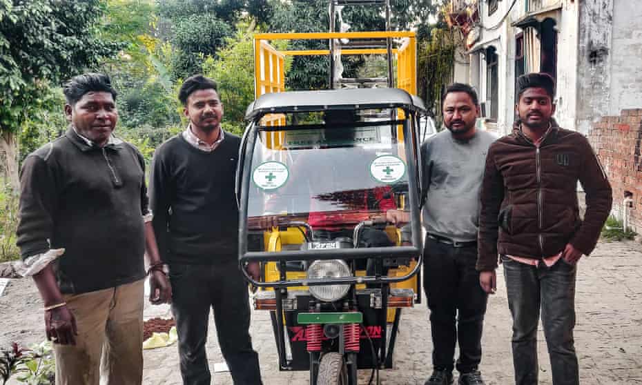 Some of the team at the Pushpa Tree and Plant Hospital and Dispensary with one of the tree ambulances converted from electric rickshaws