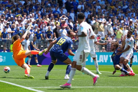 Qatar’s Hassan Al Haydos (right) finds the net to get his side back in the game.