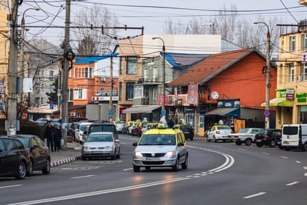 Traffic and parked cars on the main streets of Targoviste
