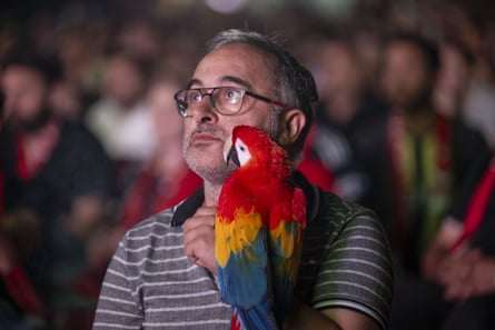 A Turkish fan, left, with his parrot.