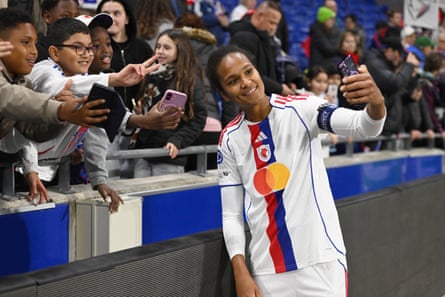 Wendie Renard takes a selfie with fans following OL Lyonnes’ 3-1 Champions League victory over Wolfsburg in November.