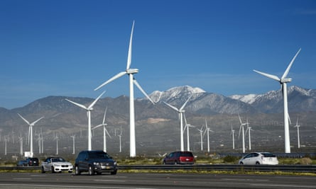 Automobiles travel along Interstate 10 as wind turbines generate electricity at the San Gorgonio Pass Wind Farm near Palm Springs, California. Located in the windy gap between Southern California’s two highest mountains, the facility is one of three major wind farms in California. (Photo by Robert Alexander/Getty Images)