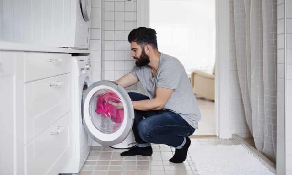 Man emptying a dryer