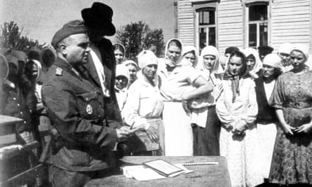Residents of a Ukrainian village are registered by Wehrmacht representatives, 1941.