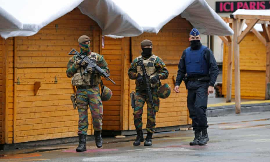 Belgian soldiers patrol in central Brussels after security was tightened in Belgium following the fatal attacks in Paris.