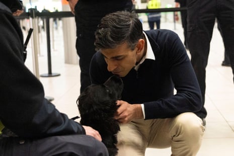 Rishi Sunak meets detector dog "Jinx" during a visit to Gatwick Airport today.