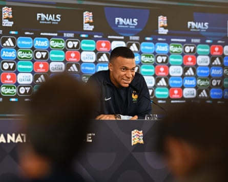 Kylian Mbappé speaks to the press