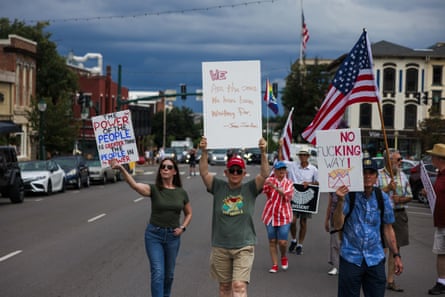 people marching and holding signs