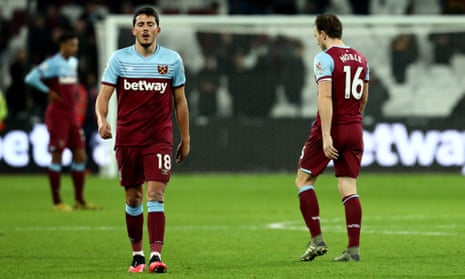 Pablo Fornals and Mark Noble look dejected after the home defeat to Liverpool in January