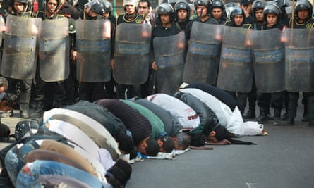 Egyptians pray street police Giza